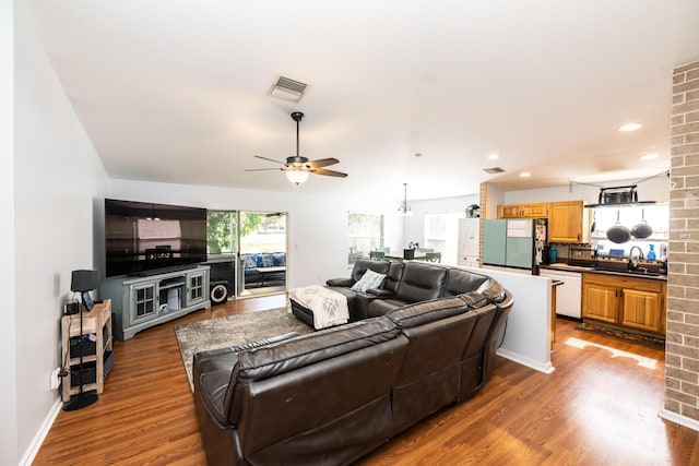 living room with sink, hardwood / wood-style floors, and ceiling fan