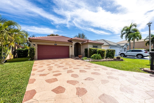 view of front of property featuring a garage and a front lawn