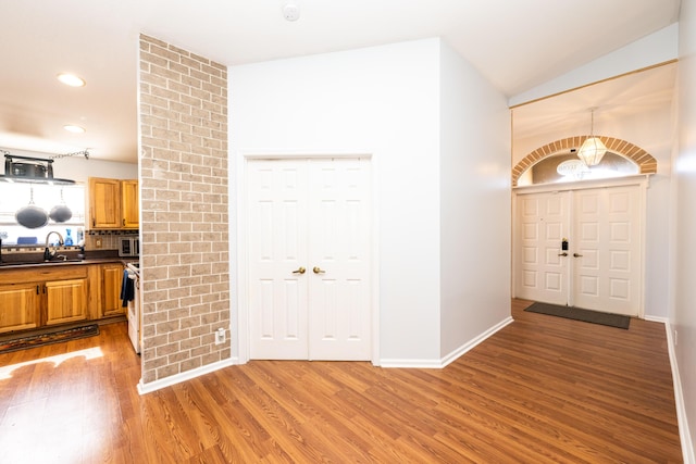 foyer featuring sink and hardwood / wood-style flooring