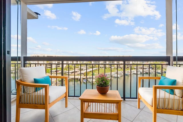 balcony featuring a water view