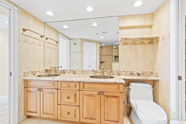 bathroom featuring tile walls, toilet, and walk in shower