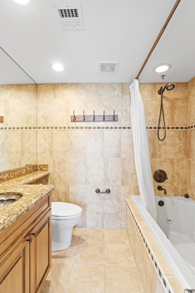 full bathroom featuring tile walls, tile patterned flooring, vanity, shower / tub combo, and toilet