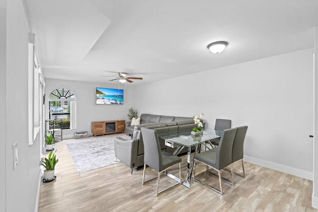 dining room featuring ceiling fan and light hardwood / wood-style flooring