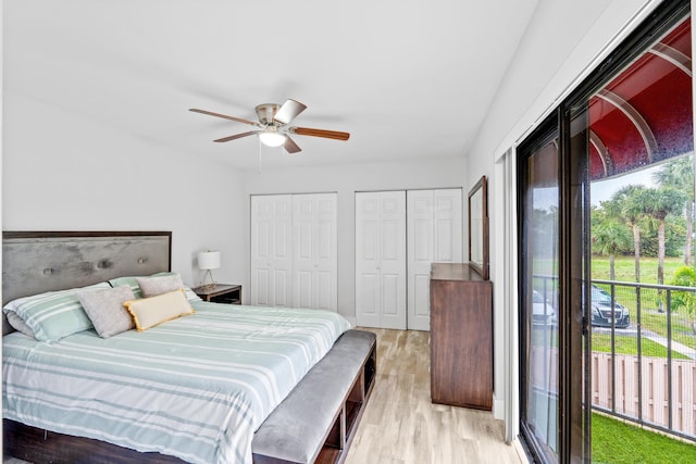 bedroom featuring multiple closets, access to outside, ceiling fan, and light hardwood / wood-style flooring