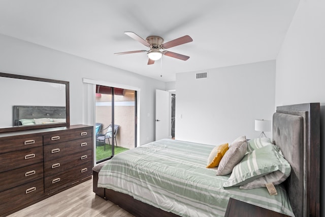 bedroom featuring ceiling fan, access to exterior, and light hardwood / wood-style flooring