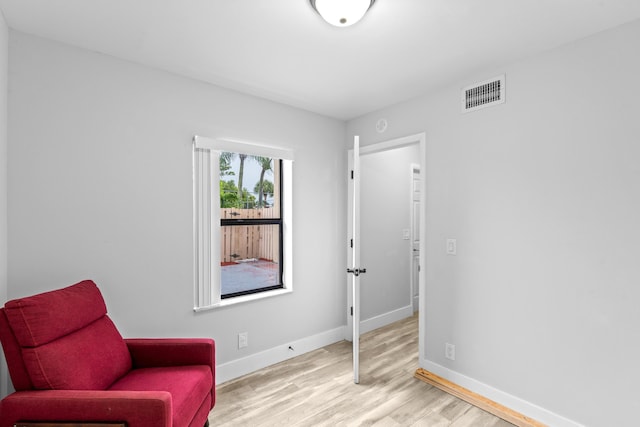 sitting room with light hardwood / wood-style flooring