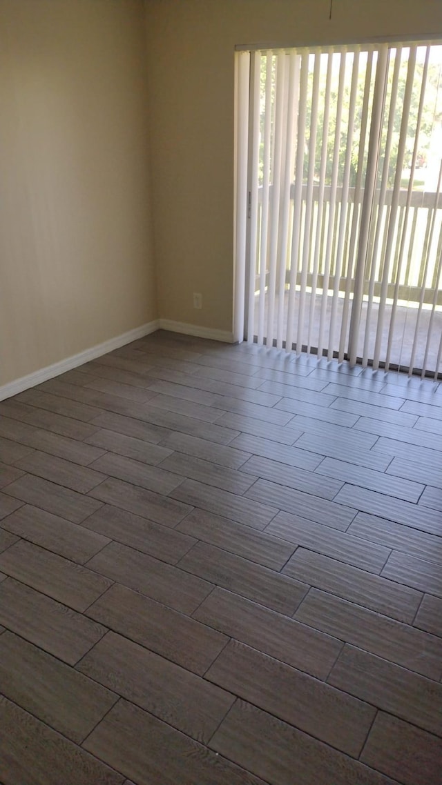 spare room featuring dark hardwood / wood-style floors