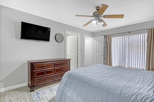 bedroom with ceiling fan and light hardwood / wood-style floors