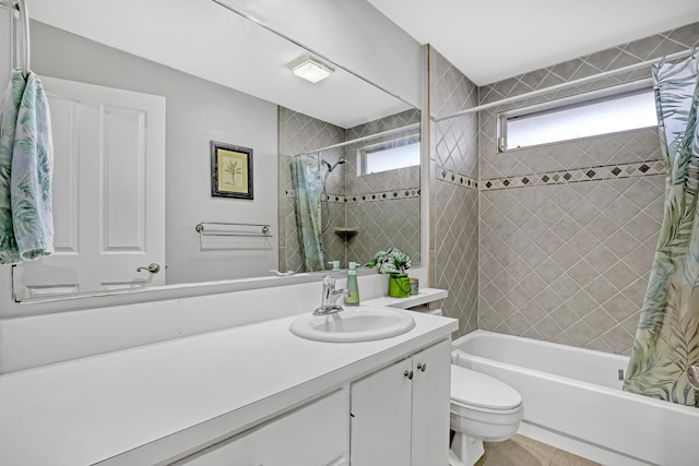 full bathroom with shower / bath combination with curtain, vanity, and toilet