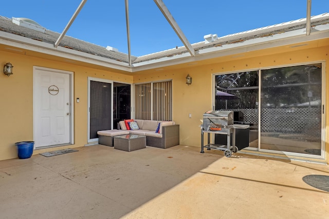 entrance to property with an outdoor living space and a patio