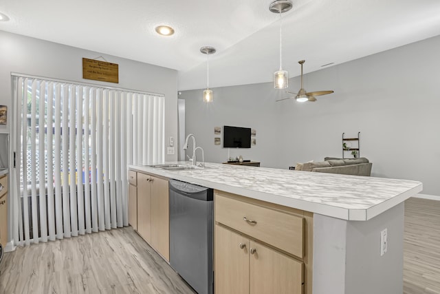 kitchen with pendant lighting, sink, light hardwood / wood-style flooring, stainless steel dishwasher, and light brown cabinets