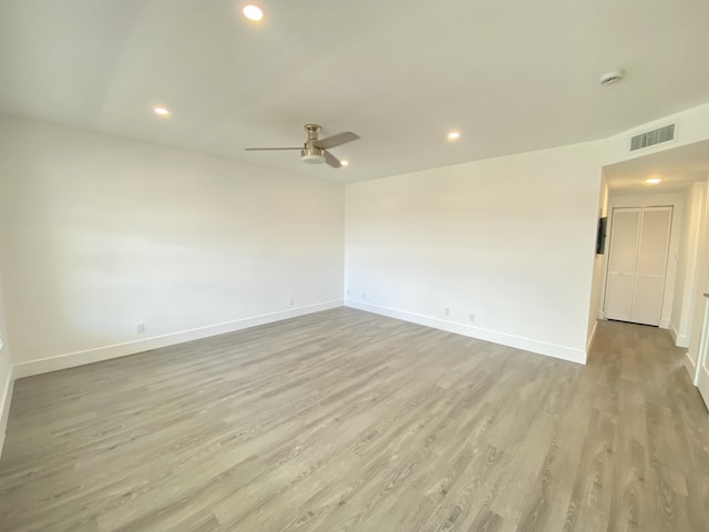 unfurnished room featuring ceiling fan and light hardwood / wood-style floors