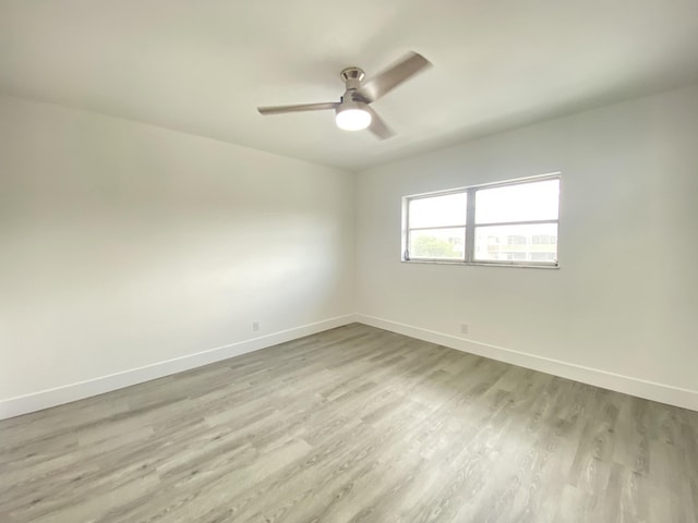 spare room with ceiling fan and light hardwood / wood-style floors