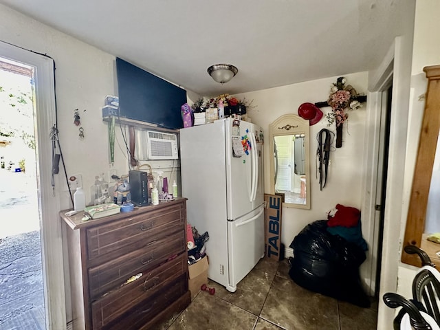 interior space featuring cooling unit, dark tile patterned floors, and white refrigerator