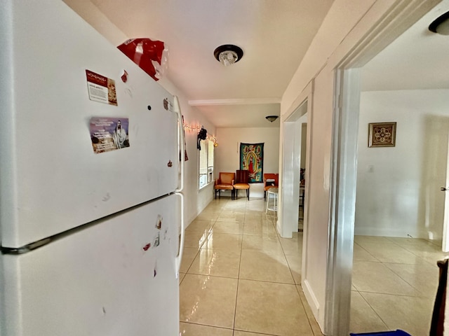 hall featuring light tile patterned floors