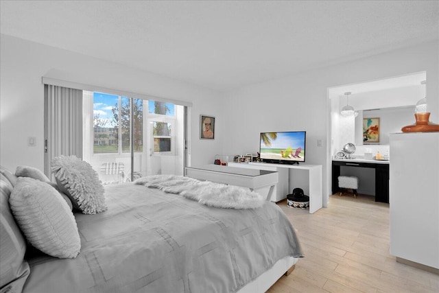 bedroom with light wood-type flooring