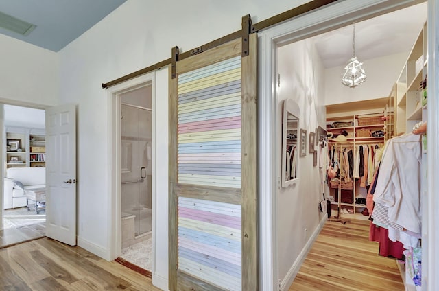 entryway featuring a barn door and light wood-type flooring