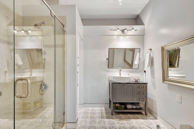 bathroom featuring vanity and a shower with shower door