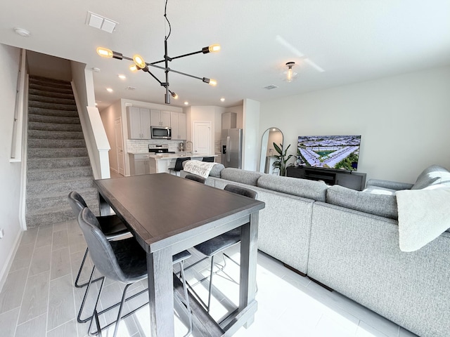 living room featuring a notable chandelier