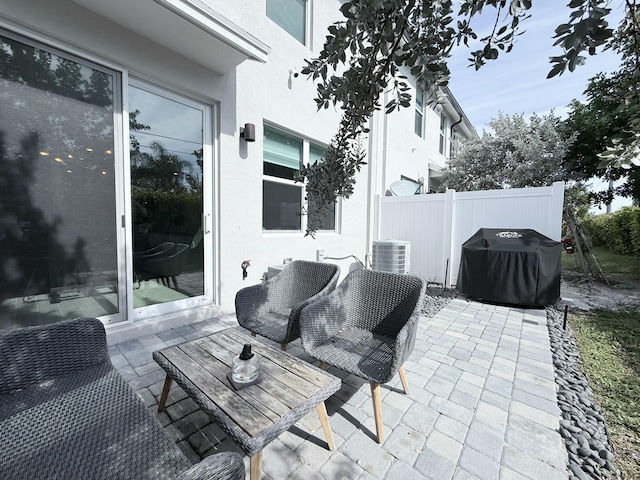 view of patio with a grill and central AC