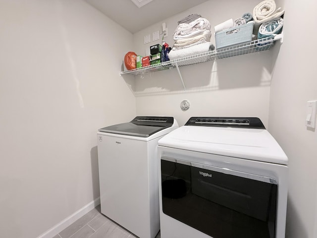 washroom featuring washing machine and dryer