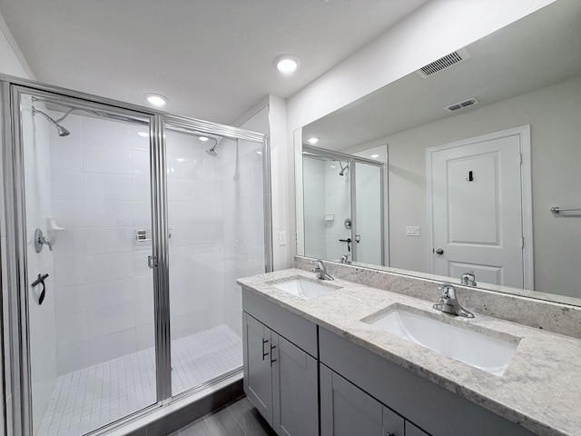 bathroom with vanity and walk in shower