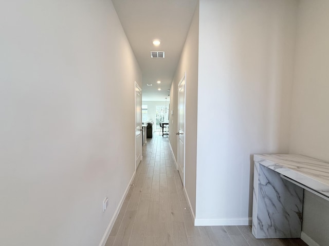 hall featuring light hardwood / wood-style floors