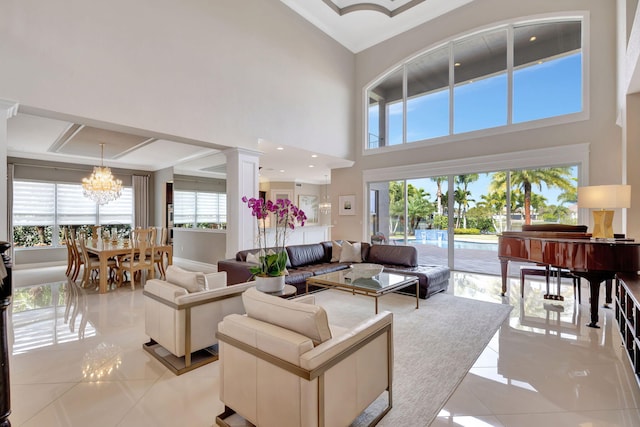 tiled living room with a towering ceiling and a notable chandelier