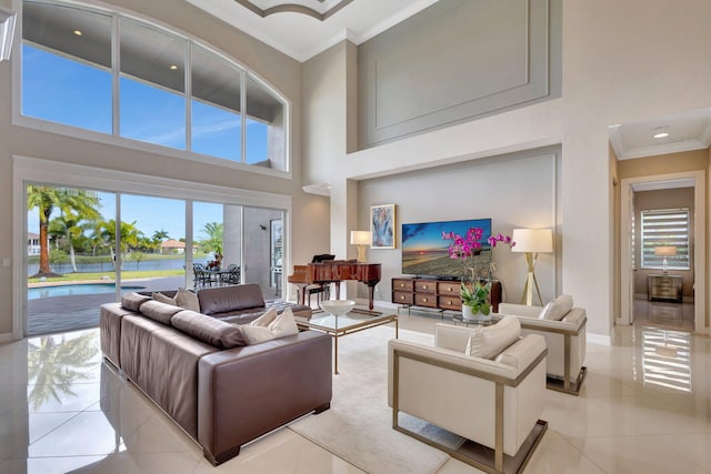 tiled living room featuring a high ceiling and ornamental molding