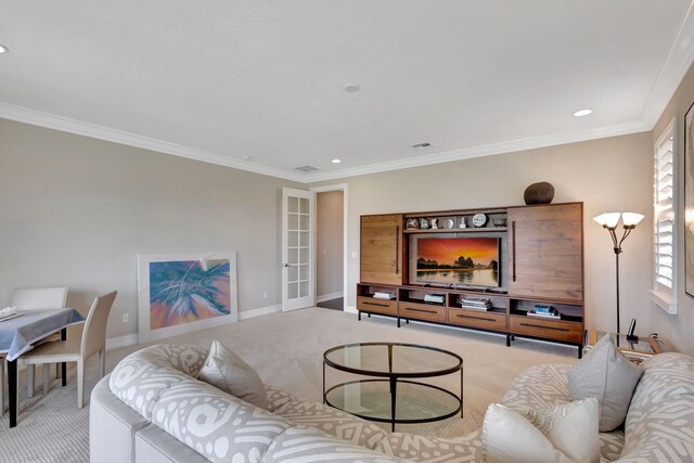 carpeted living room with crown molding