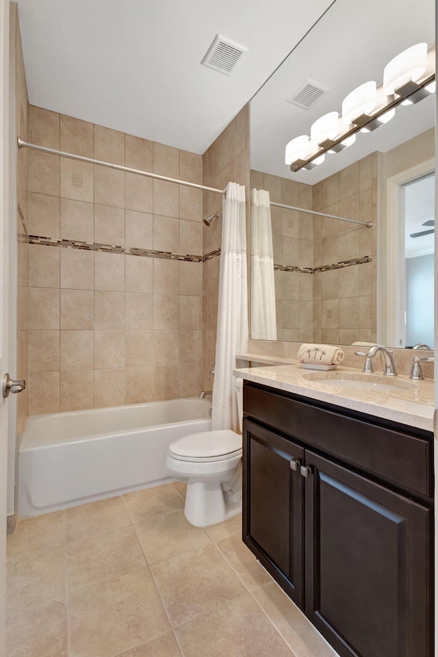 full bathroom featuring vanity, toilet, tile patterned floors, and shower / bath combo with shower curtain