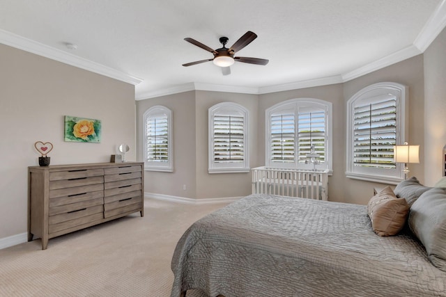 carpeted bedroom with crown molding and ceiling fan