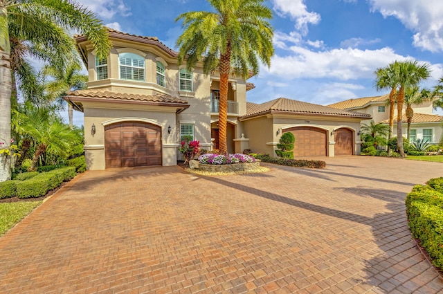 mediterranean / spanish-style home featuring a garage