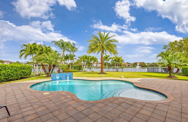 view of pool featuring a water view, pool water feature, a yard, and a patio area