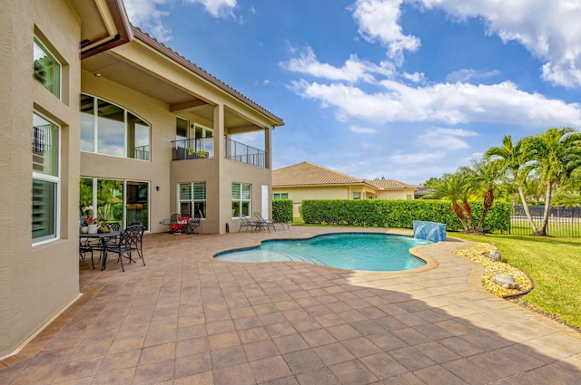 view of pool featuring a patio