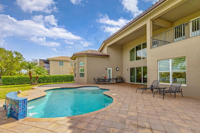 view of swimming pool featuring a patio and pool water feature