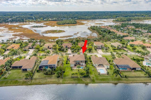 birds eye view of property with a water view