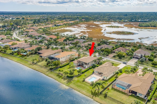 birds eye view of property featuring a water view