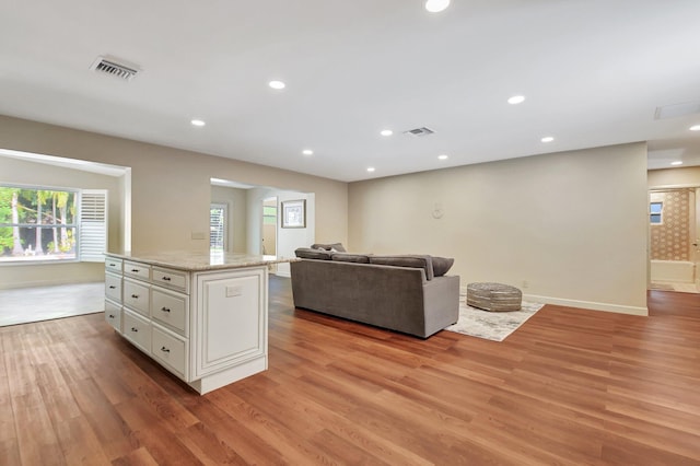 living room with light hardwood / wood-style flooring