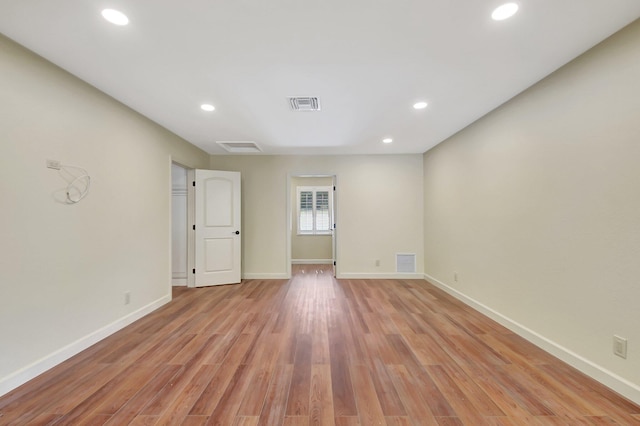 spare room with light hardwood / wood-style floors