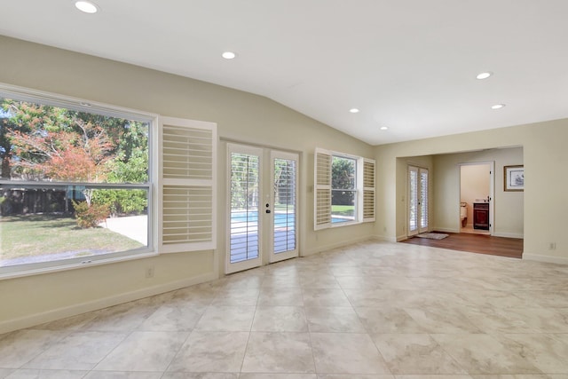 interior space with vaulted ceiling and french doors