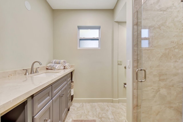 bathroom with vanity and a shower with door