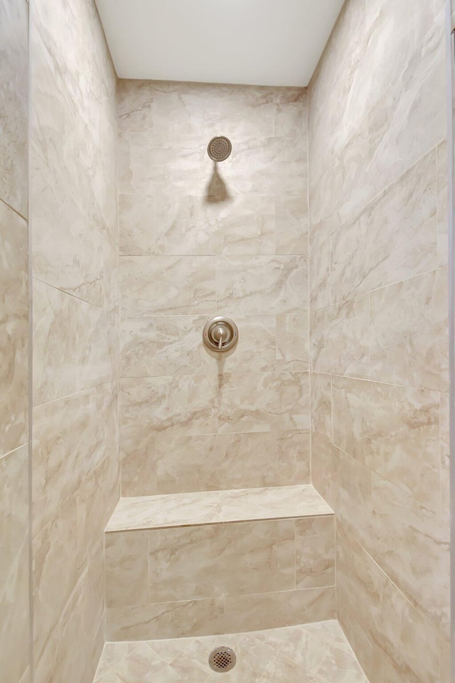 bathroom with a tile shower