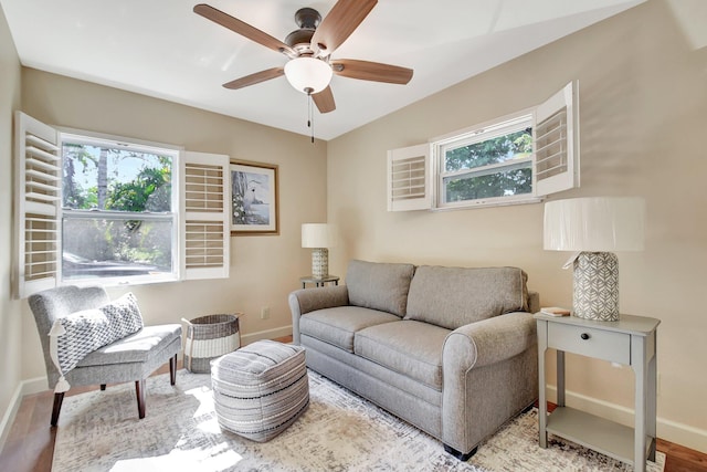 living room with ceiling fan, a healthy amount of sunlight, and light hardwood / wood-style floors