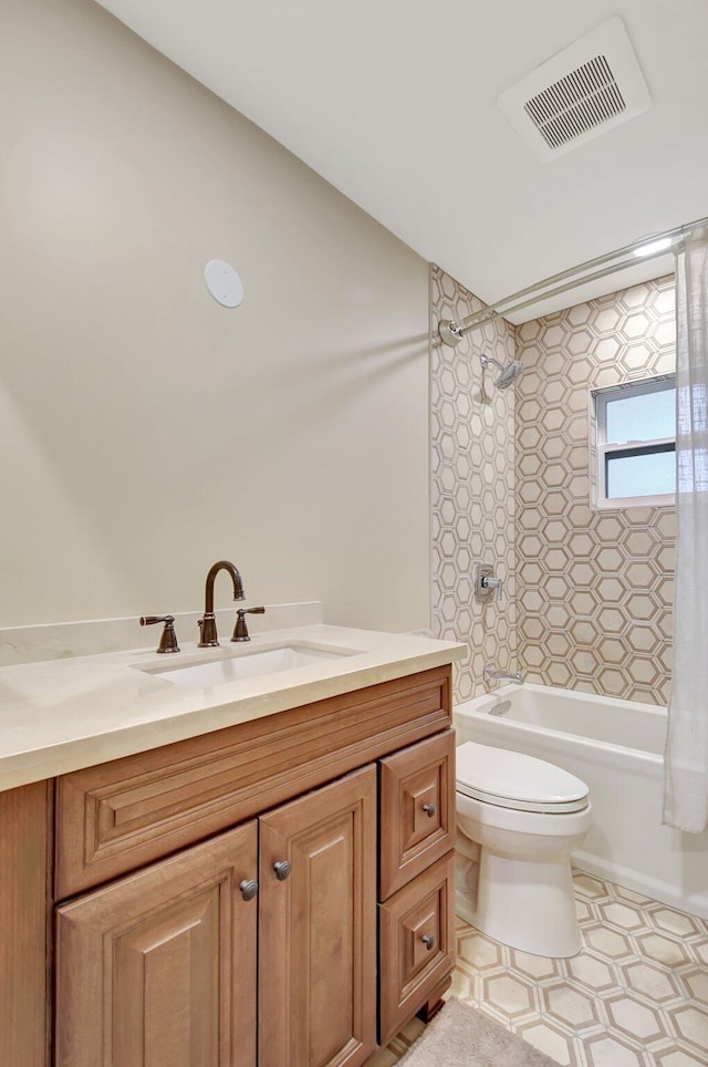 full bathroom with vanity, toilet, and shower / bath combo with shower curtain