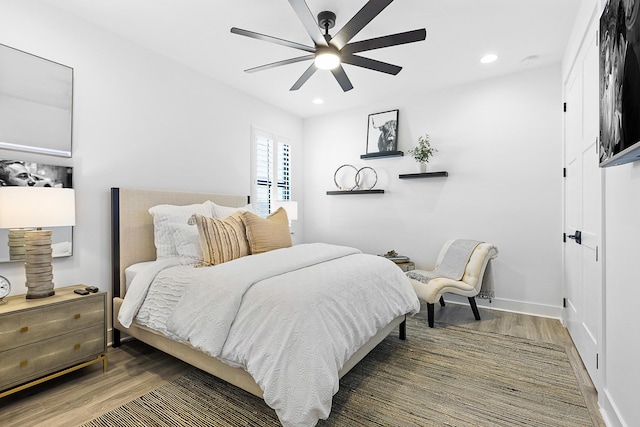 bedroom featuring ceiling fan and dark hardwood / wood-style floors