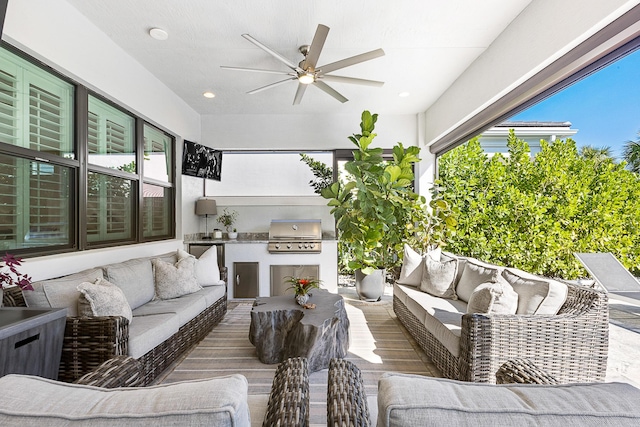 view of patio / terrace featuring area for grilling, grilling area, outdoor lounge area, and ceiling fan