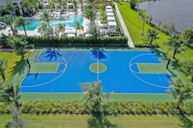 view of basketball court with a water view