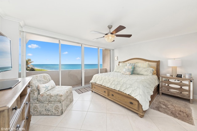 tiled bedroom with a water view, ceiling fan, and ornamental molding