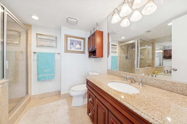 bathroom featuring vanity, an enclosed shower, tile patterned floors, and toilet